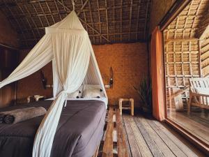 A bed or beds in a room at Sasak Experience