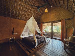 A bed or beds in a room at Sasak Experience