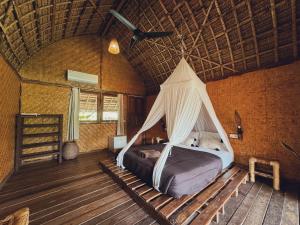 A bed or beds in a room at Sasak Experience