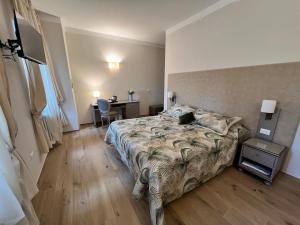 Postel nebo postele na pokoji v ubytování Hotel San Lino