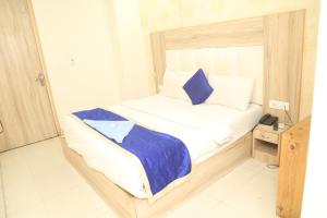 Postel nebo postele na pokoji v ubytování Hotel Aman Inn