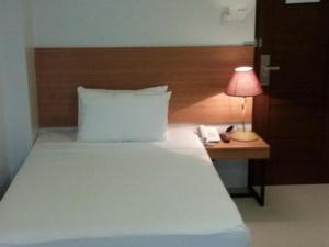 Postel nebo postele na pokoji v ubytování Mango Suites - Isabela