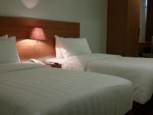 Postel nebo postele na pokoji v ubytování Mango Suites - Isabela