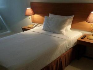 Postel nebo postele na pokoji v ubytování Mango Suites - Isabela