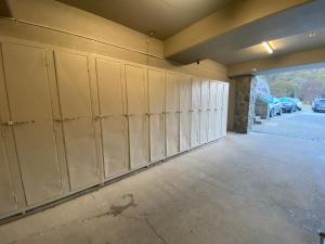 a long row of lockers in a garage at Lantern 28 - Loft in Thredbo