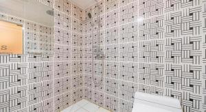 a bathroom with a white and black patterned wall at Hotel S Shinchon in Seoul +213 photos