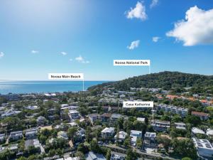an aerial view of a city with houses and the ocean at Casa Katharina – Your Coastal Escape on Noosa Hill in Noosa Heads