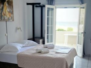 Postel nebo postele na pokoji v ubytování Platsa Apartments