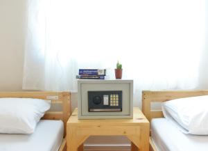 Postel nebo postele na pokoji v ubytování PanPan Hostel
