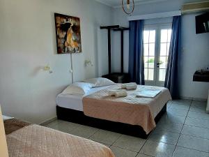 Postel nebo postele na pokoji v ubytování Platsa Apartments