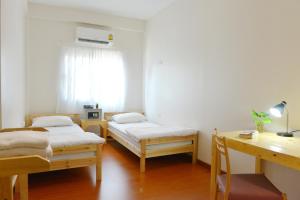 Postel nebo postele na pokoji v ubytování PanPan Hostel