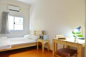 Postel nebo postele na pokoji v ubytování PanPan Hostel