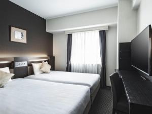 TV a/nebo společenská místnost v ubytování Hotel New Hankyu Osaka Annex