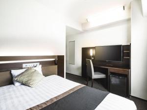 Postel nebo postele na pokoji v ubytování Hotel New Hankyu Osaka Annex