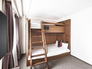 Postel nebo postele na pokoji v ubytování Hotel New Hankyu Osaka Annex