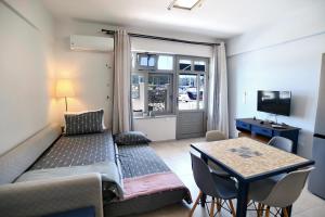 a living room with a couch and a table at FantaSea Apartment in Vlikhón