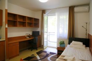 Postel nebo postele na pokoji v ubytování Auguszta Hotel