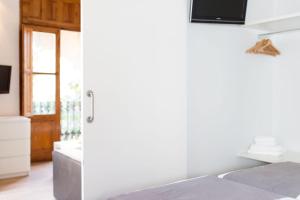 Cama o camas de una habitación en Valenciaflats Torres de Serrano