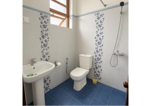 a bathroom with a toilet and a sink at Ranaya Residence Kandy in Kandy +35 photos
