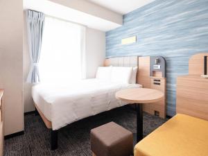 Postel nebo postele na pokoji v ubytování Comfort Hotel Tokyo Kiyosumi Shirakawa