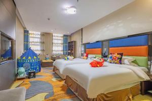 Ένα ή περισσότερα κρεβάτια σε δωμάτιο στο Dujiangyan Liwan Holiday Hotel +237 φωτογραφίες