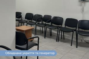 a row of black chairs and a table in a room at Black Sea Central in Odesa