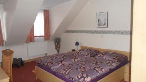 Postel nebo postele na pokoji v ubytování Hotel Eigelstein