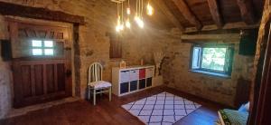 a small kitchen with a door and a window at Cabaña Pasiega Lucas in Bustantegua
