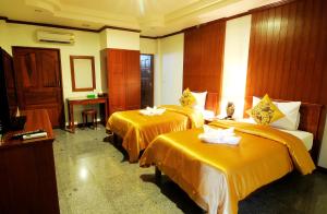 Ένα ή περισσότερα κρεβάτια σε δωμάτιο στο Busyarin Hotel