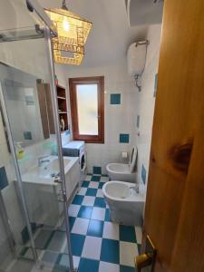 a bathroom with a sink and a toilet and a shower at Golden Dune View in Torre Dei Corsari