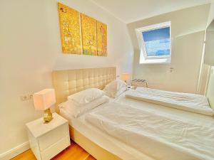 Posteľ alebo postele v izbe v ubytovaní Steiner Residences Vienna Nestroyplatz