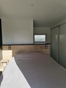 Postel nebo postele na pokoji v ubytování Ty-koad