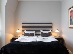 Postel nebo postele na pokoji v ubytování Elite Stadshotellet Västerås