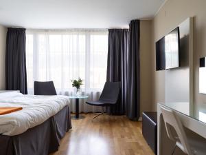 Postel nebo postele na pokoji v ubytování Elite Stadshotellet Västerås