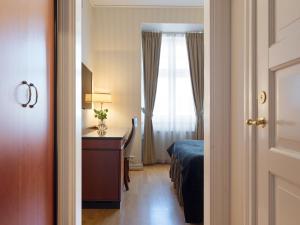 Postel nebo postele na pokoji v ubytování Elite Stadshotellet Västerås