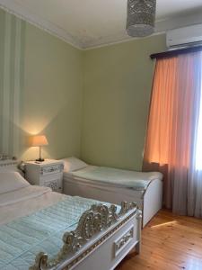 Voodi või voodid majutusasutuse Holiday House toas