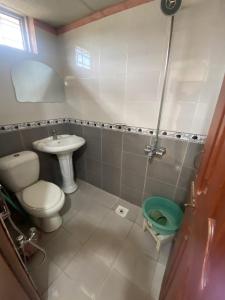 a small bathroom with a toilet and a sink at 2 Bedrooms innara Rooms Bhurban A1 in Bhurban