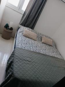 Ένα ή περισσότερα κρεβάτια σε δωμάτιο στο Mini Casa