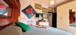 a bedroom with a bed with a tray of food on it at Scopello Dream House, villaggio CALA AZZURRA in Scopello