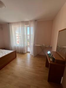 a bedroom with a bed and a large window at Fort Noks with sea view in Elenite +17 photos