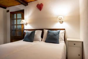 Rúm í herbergi á Chalet Casa dei Nonni