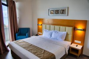 Postel nebo postele na pokoji v ubytování Hotel Sentral Seaview @ ​Beachfront
