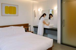 Postel nebo postele na pokoji v ubytování Moor Hotel Mokpo By Aank