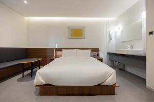 Postel nebo postele na pokoji v ubytování Moor Hotel Mokpo By Aank