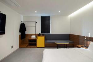 Postel nebo postele na pokoji v ubytování Moor Hotel Mokpo By Aank