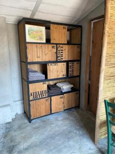 a book shelf filled with boxes in a room at Stazzu Pittorra in Barrabisa