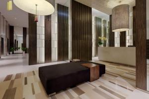 a room with a bed in the middle of it at The Costa Nha Trang Residences in Nha Trang