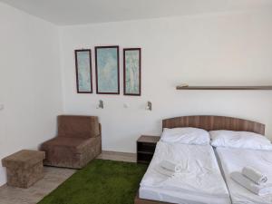 Postel nebo postele na pokoji v ubytování Moderný Apartmán v Podhájskej
