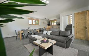 a living room with a couch and a table at Beautiful Home In Maglenca With Sauna in Maglenča
