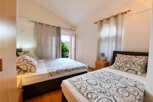 Postel nebo postele na pokoji v ubytování Villa Lilly 3